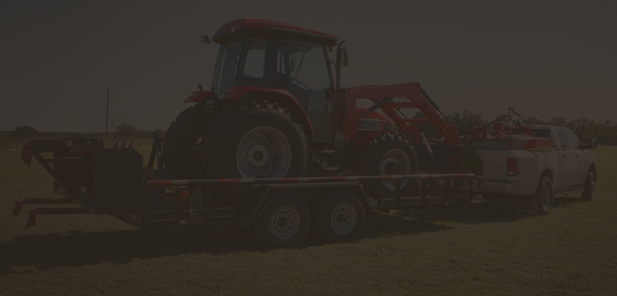Tractor Loaded onto Flatbed Trailer