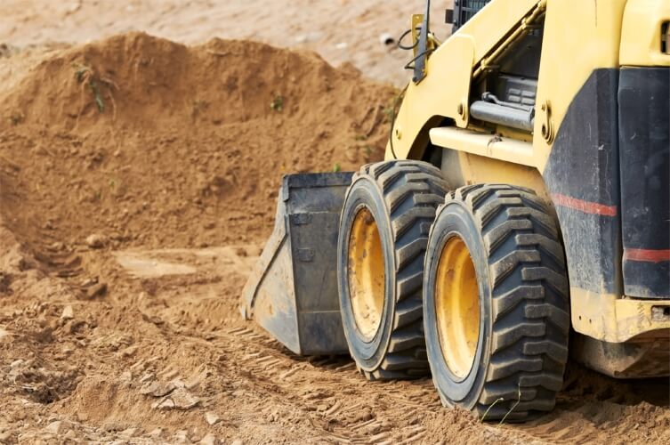CAT Wheel Skid Steer Loader with Bucket Attachment